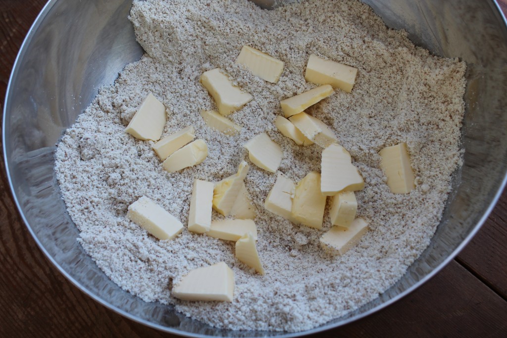cold chunks of butter go into the mixed dry ingredients