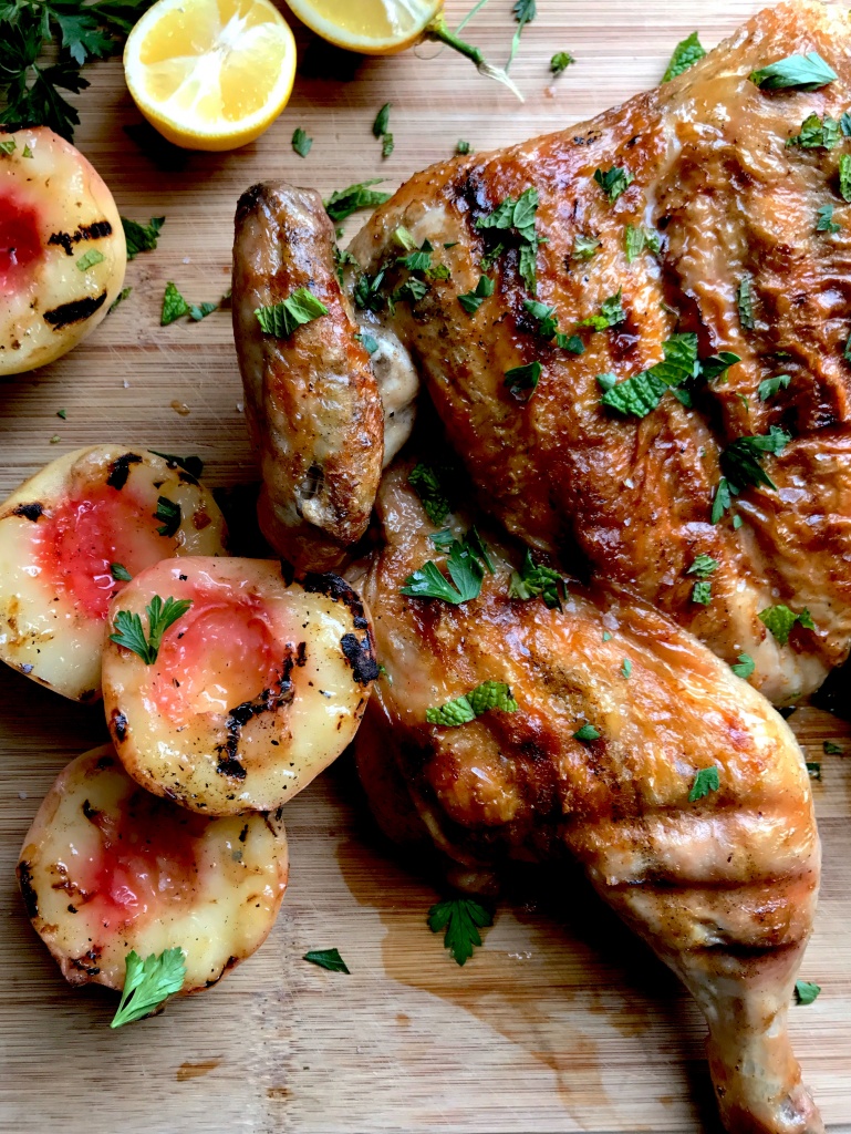 grilled chicken under a brick