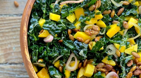 easy kale salad with mango, spiced pepitas & pickled shallots